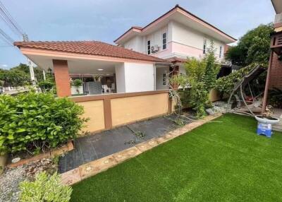 Front view of a two-story house with a lawn