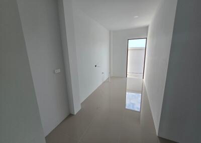 Empty Room with White Walls and Tiled Floor