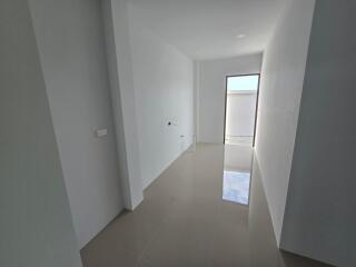 Empty Room with White Walls and Tiled Floor