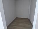 Empty small room with wooden floor