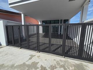 Exterior view of a property with a gated entrance