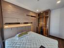 Modern bedroom with built-in wardrobe and stylish lighting