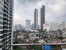 View from the balcony showing cityscape with tall buildings