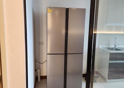 Modern kitchen with double-door stainless steel refrigerator