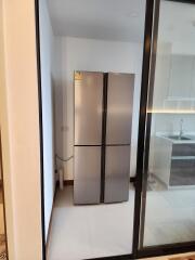 Modern kitchen with double-door stainless steel refrigerator