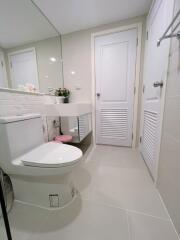 Modern bathroom with white fixtures and minimalistic design