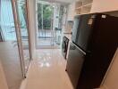 Modern kitchen with black appliances and large window