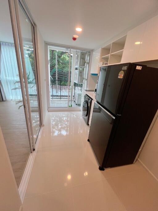 Modern kitchen with black appliances and large window