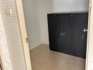 Compact room with a black cabinet