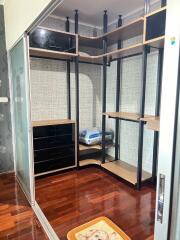 Spacious walk-in closet with shelves and drawers