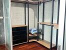 Spacious walk-in closet with shelves and drawers