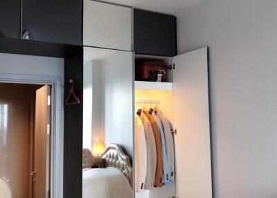 Bedroom with closet and bathroom entrance