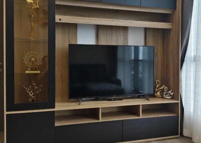 Modern living room with TV and decorative shelves