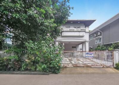 Two-story house with a gated front yard