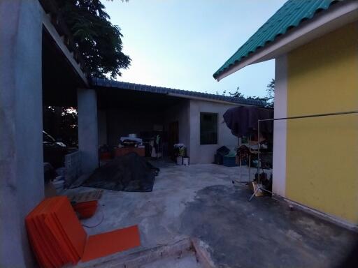 Outdoor area of a property with visible structures and materials.