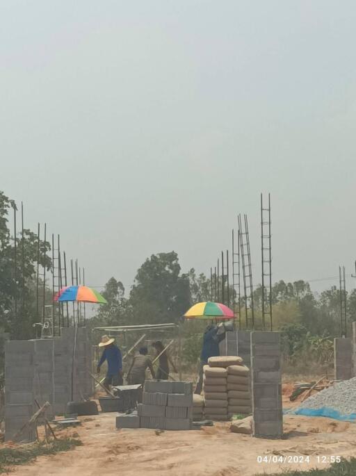 Under-construction building with workers