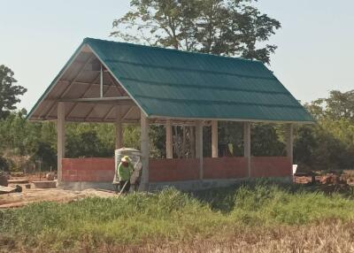 Under-construction building in a field