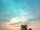 Small house during sunset with a clear, calm sky