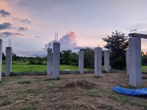 Under construction building with concrete pillars