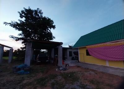 Exterior view of a building with a covered carport