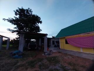 Exterior view of a building with a covered carport