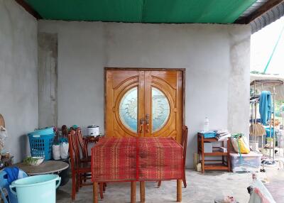 Outdoor sitting area with wooden door