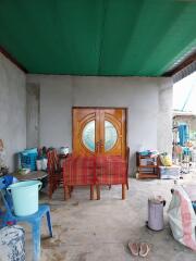 Outdoor sitting area with wooden door