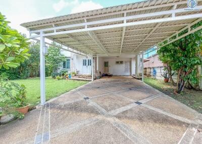 Covered carport with driveway