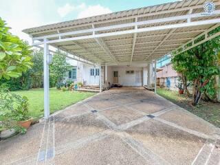 Covered carport with driveway