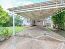 Covered carport with driveway