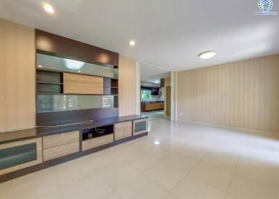 Spacious and well-lit living room with modern built-in cabinets