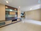 Spacious and well-lit living room with modern built-in cabinets