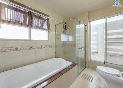 Modern bathroom with tub and shower area