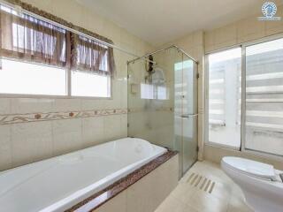 Modern bathroom with tub and shower area