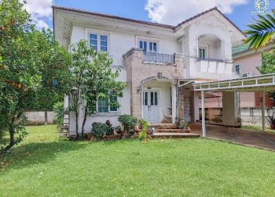 Front view of the house with a garden