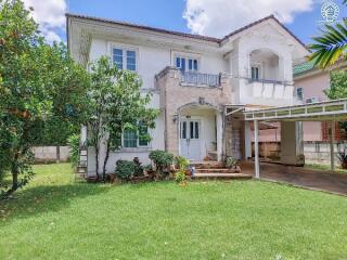 Front view of the house with a garden