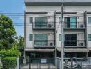 Front view of a modern three-story townhouse