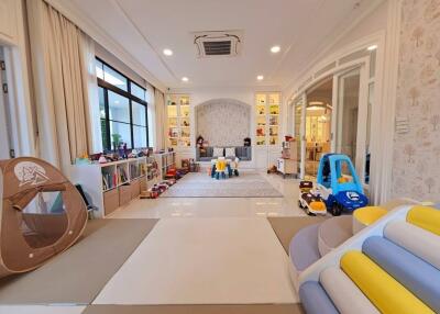 Spacious playroom with toys and play equipment