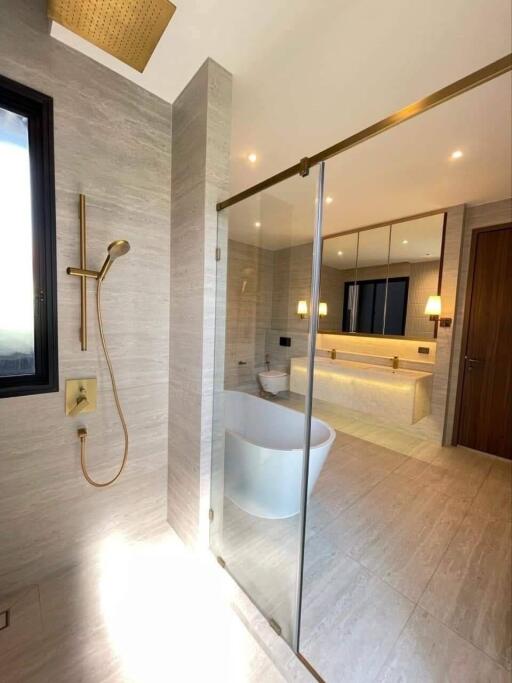 Modern bathroom with freestanding tub and glass-enclosed shower