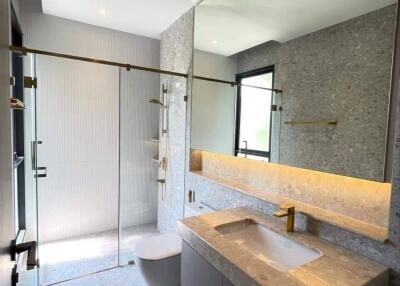 Modern bathroom with large mirror and glass shower