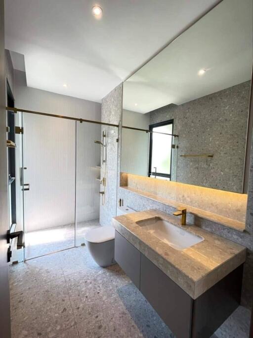 Modern bathroom with large mirror and glass shower