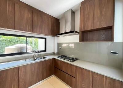 Modern kitchen with wooden cabinets and built-in appliances