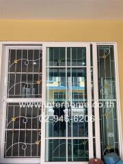 Image of window with bars and sliding glass doors