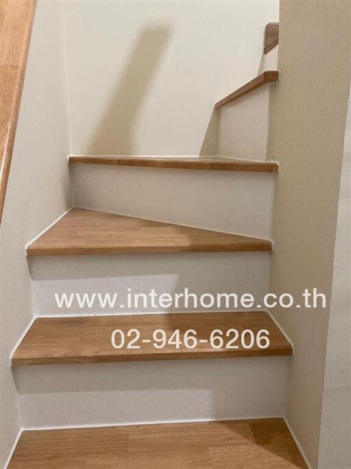 Wooden staircase with white risers