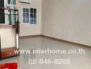 vacant living room with tiled flooring and glass shelving unit