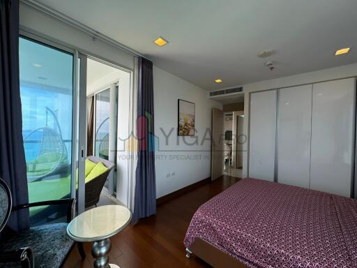 Bedroom with balcony and ocean view