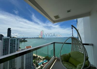 Balcony with panoramic ocean view and hanging chair