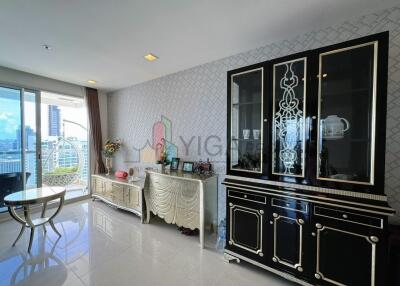 Spacious and elegantly decorated living room with modern furnishings and a balcony view