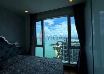 Bedroom with large window offering a scenic view