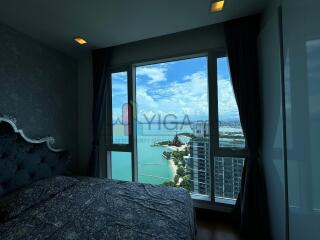 Bedroom with large window offering a scenic view